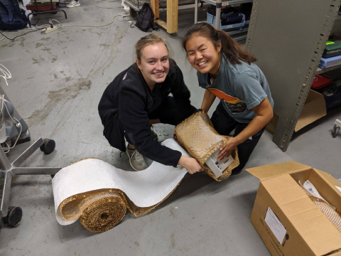 CWRU Medwish Students packing up device for shipment