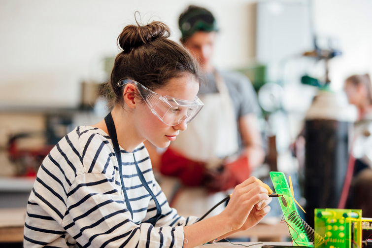 Female engineering student working in a lab